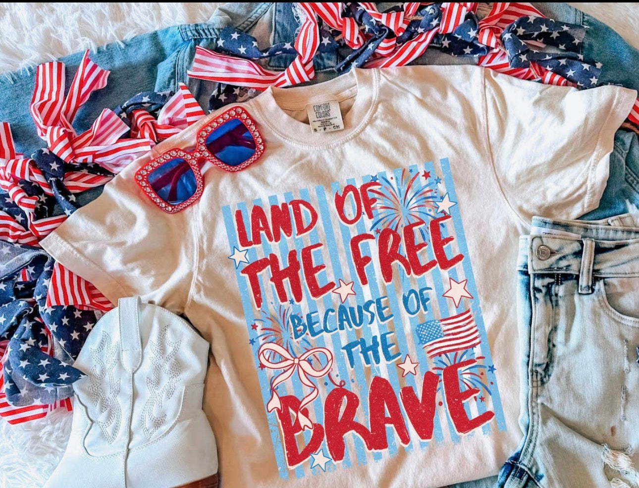 LAND OF THE FREE BECAUSE OF THE BRAVE TEE